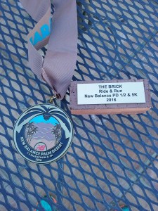 Finisher's Medal and Brick for run and ride
